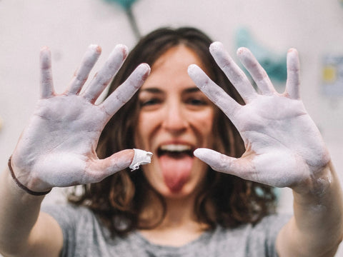 a woman making a silly face with her hands